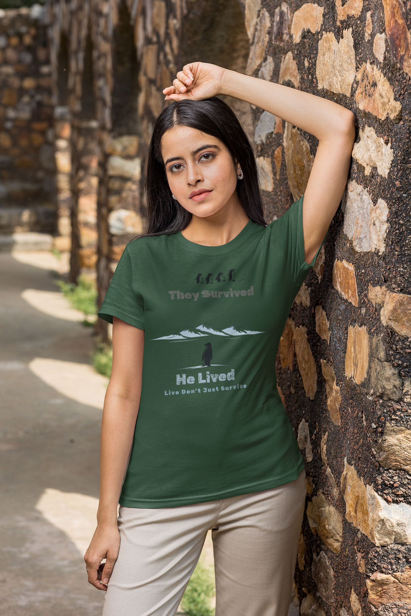 Minimalist penguin design with inspirational quote “They survived. He lived.” t-shirt style graphic.