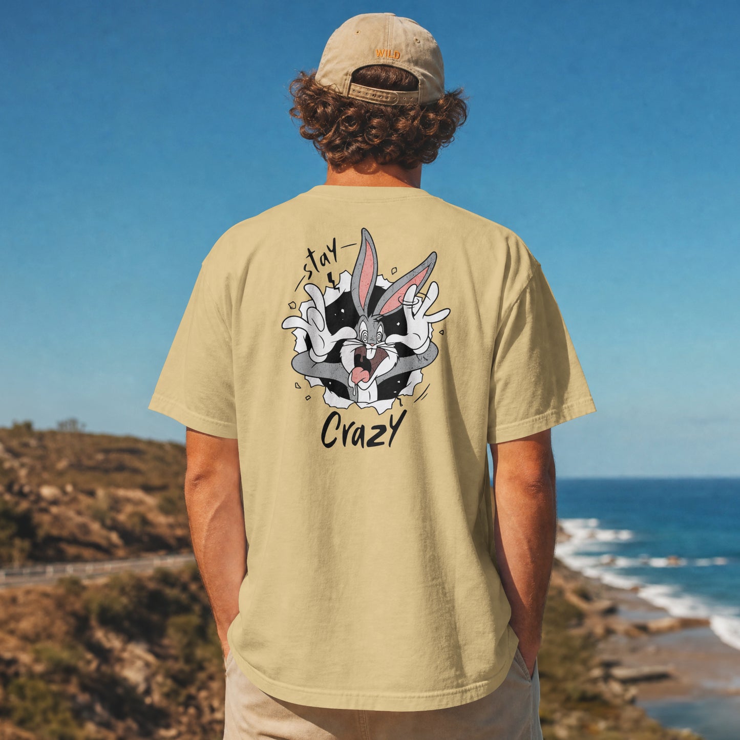 Grey oversized unisex t-shirt with a Stay Crazy Bugs Bunny graphic breaking through the fabric, back view
