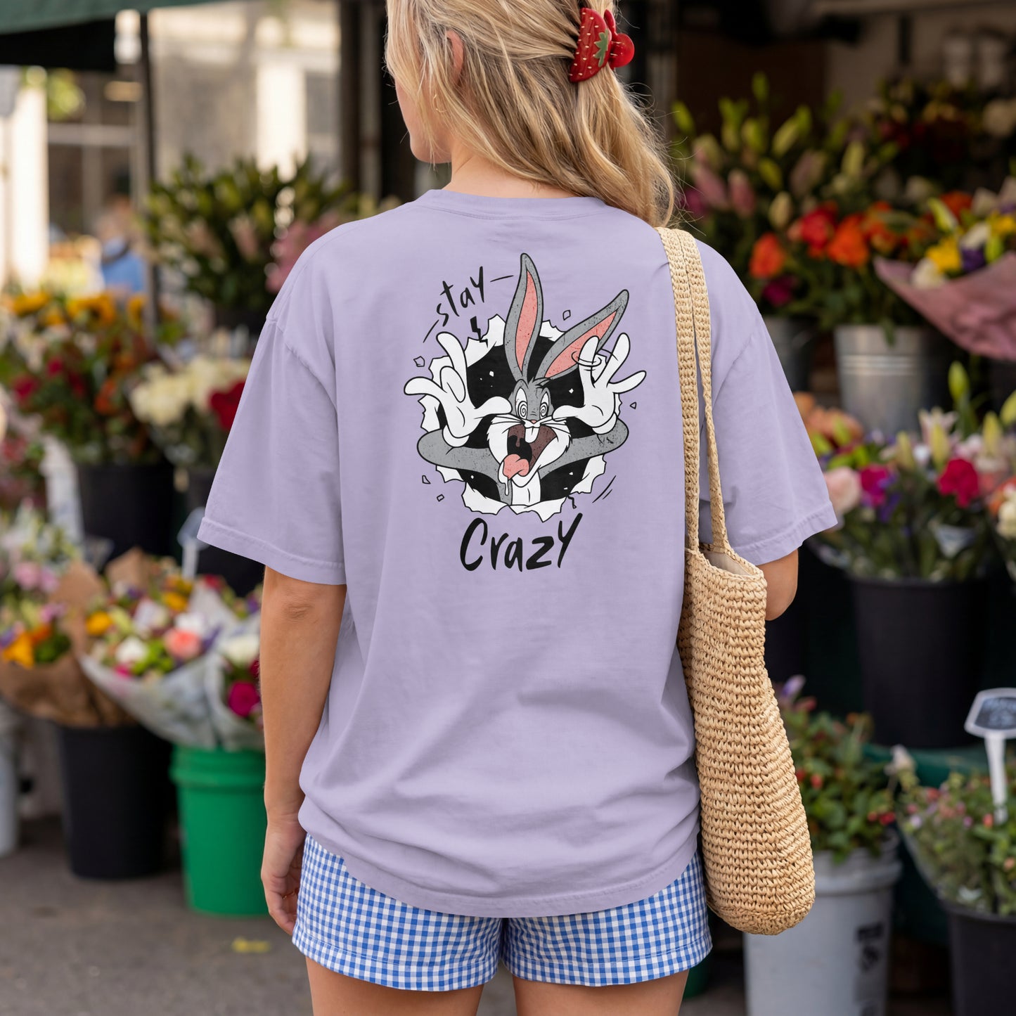 Grey oversized unisex t-shirt with a Stay Crazy Bugs Bunny graphic breaking through the fabric, back view