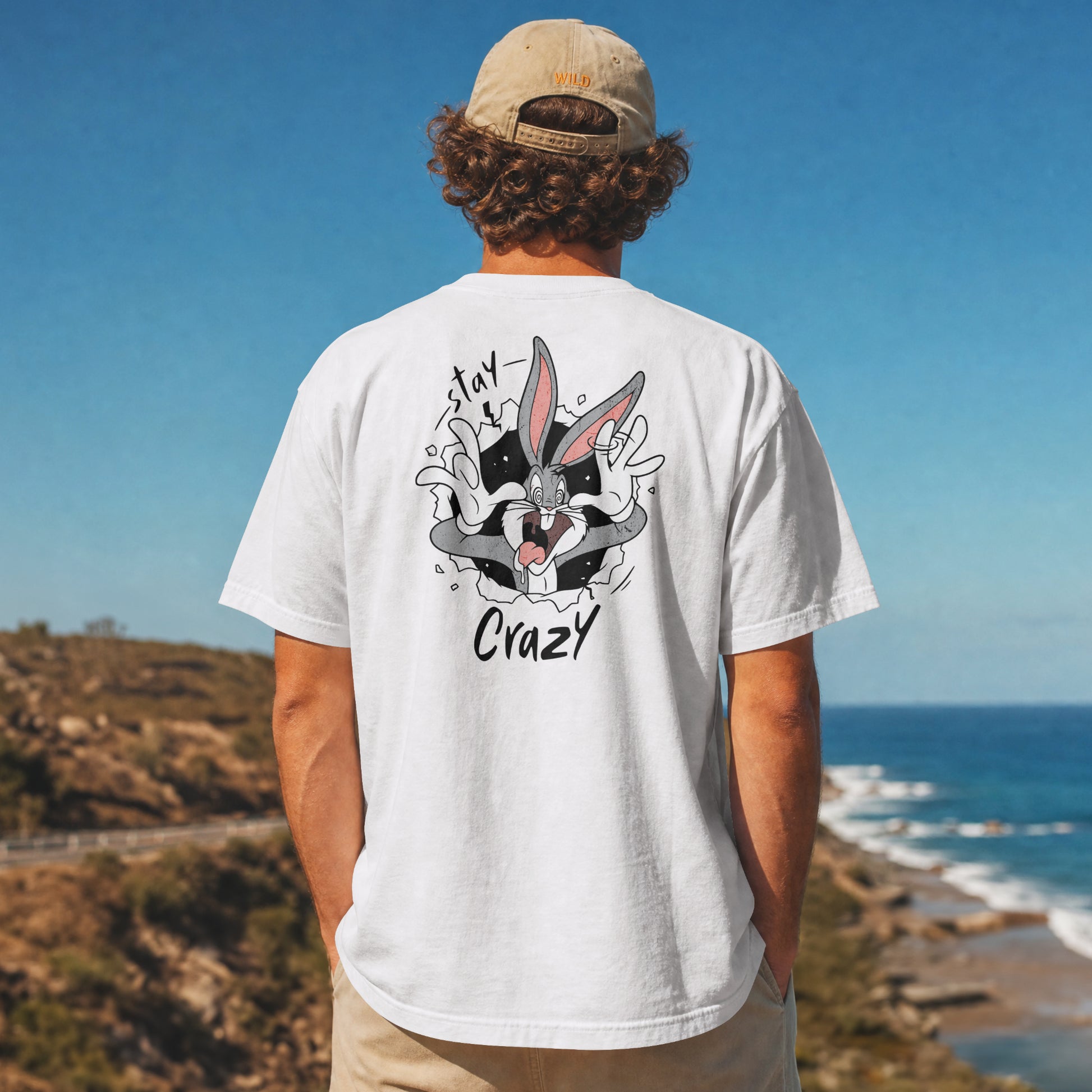 Grey oversized unisex t-shirt with a Stay Crazy Bugs Bunny graphic breaking through the fabric, back view