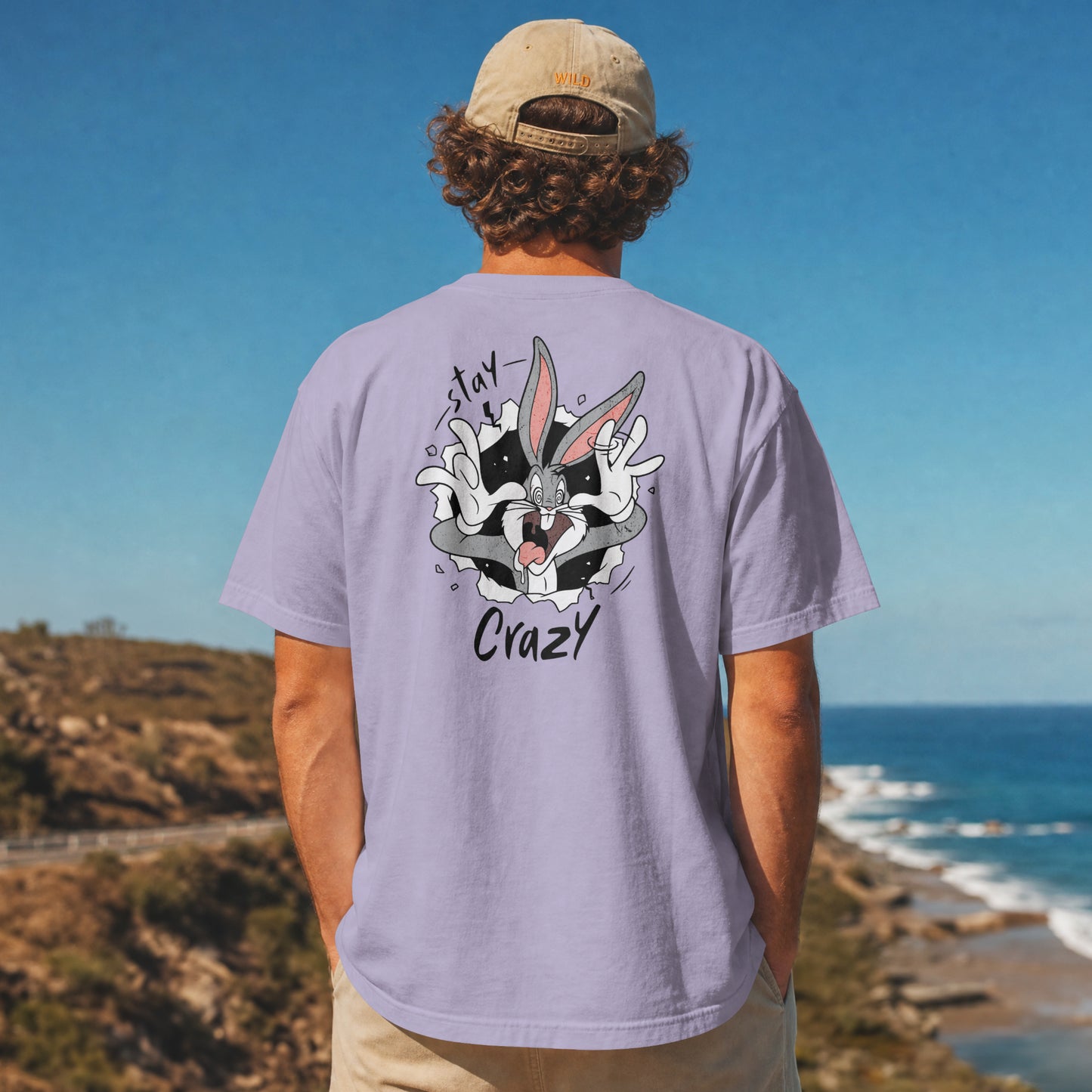 Grey oversized unisex t-shirt with a Stay Crazy Bugs Bunny graphic breaking through the fabric, back view