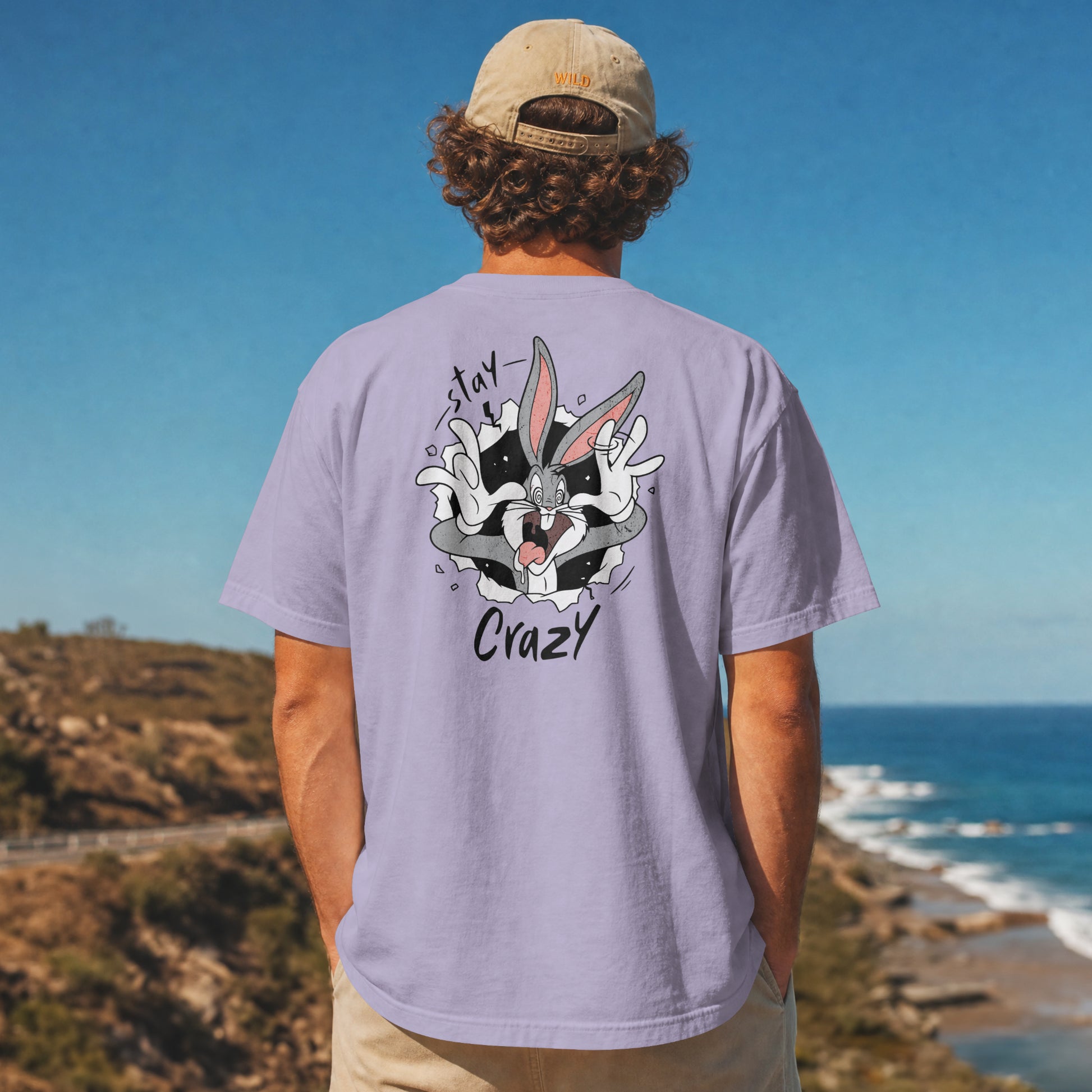 Grey oversized unisex t-shirt with a Stay Crazy Bugs Bunny graphic breaking through the fabric, back view