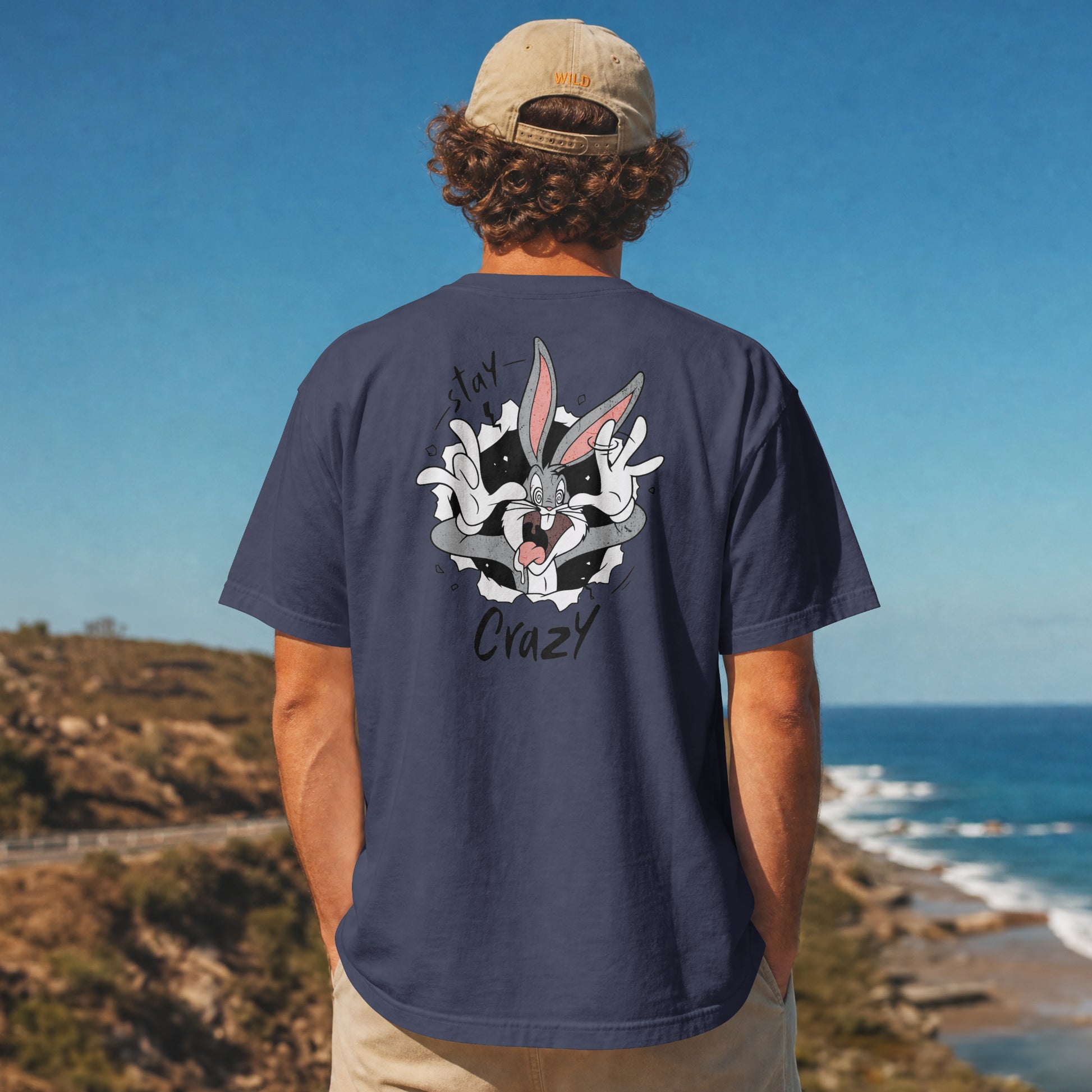 Grey oversized unisex t-shirt with a Stay Crazy Bugs Bunny graphic breaking through the fabric, back view