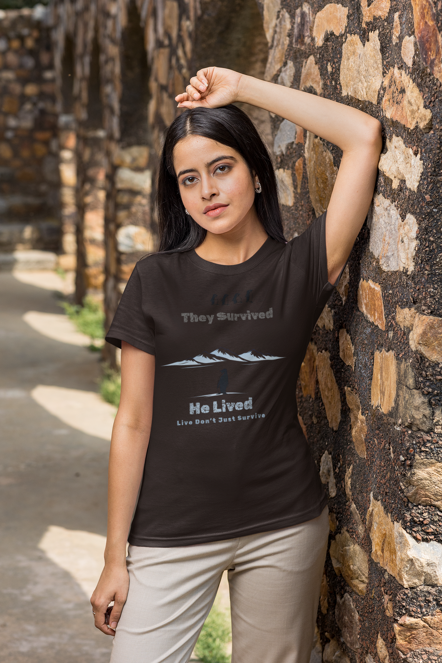 Minimalist penguin design with inspirational quote “They survived. He lived.” t-shirt style graphic.
