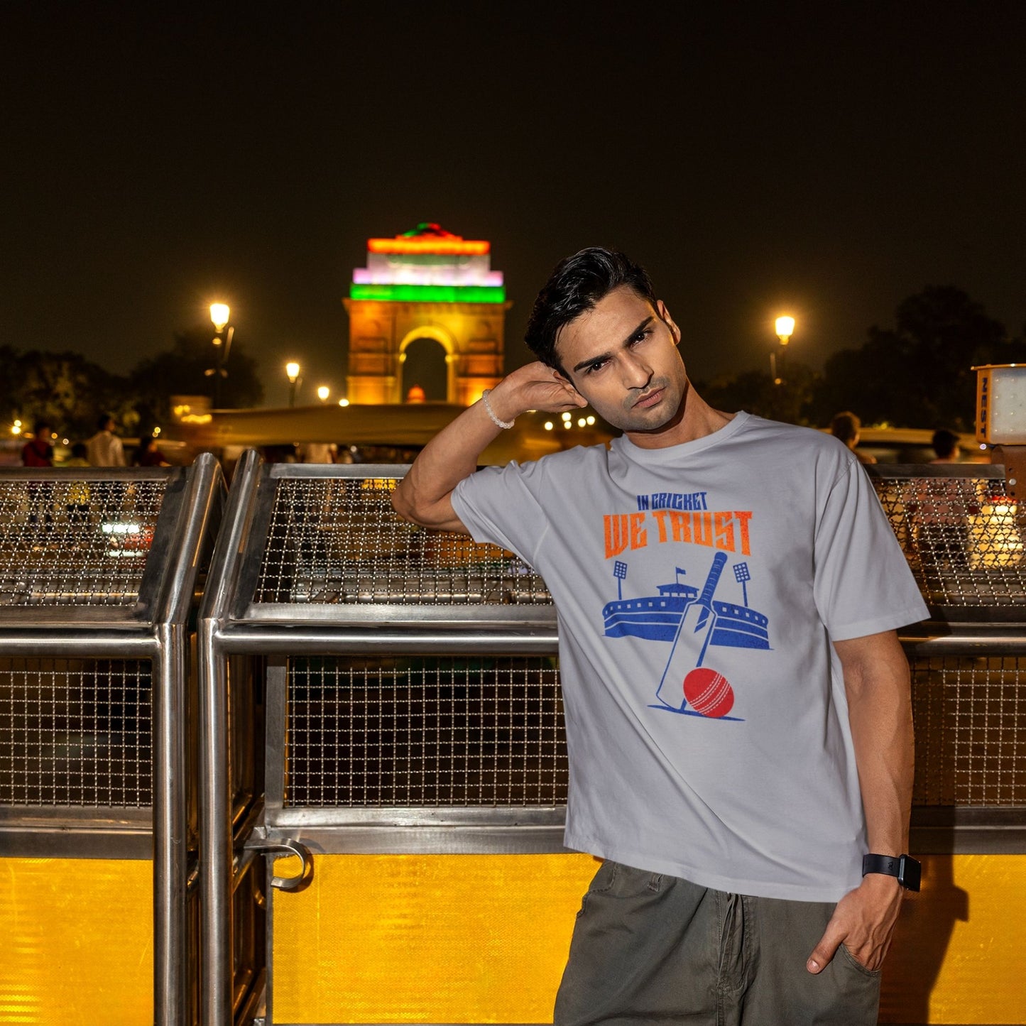 In Cricket We Trust oversized t-shirt design with cricket bat, ball and stadium graphic