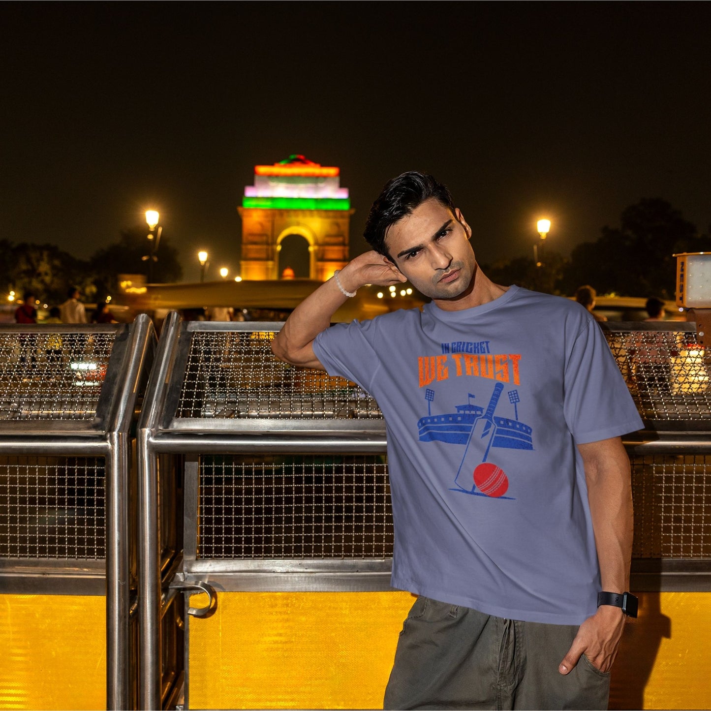 In Cricket We Trust oversized t-shirt design with cricket bat, ball and stadium graphic