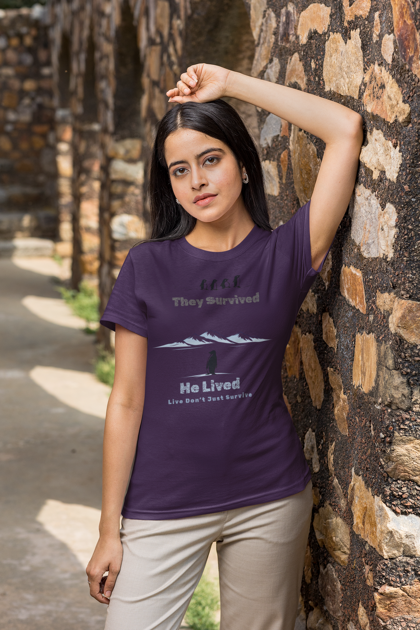 Minimalist penguin design with inspirational quote “They survived. He lived.” t-shirt style graphic.
